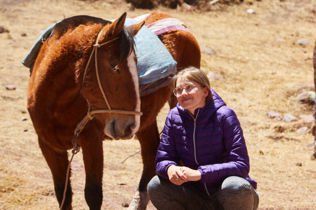 Taking a tour in the peruvian mountains is possible despite being allergic to horses. Kallpa Adventures was very considerate and thoughtful, they kept the safety horse at a safe distance all times. For a final shot after the hike I went close to a horse to take this photo as a memory 